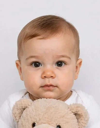 Indian baby passport photo rejected because a toy is visible in the photo